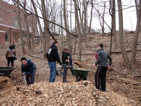 Stamford teenagers building a schoolyard habitat at Springdale Elementary School.