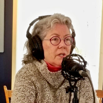 Judy Preston, the Long Island Sound partnership Outreach Coordinator, is talking into a microphone at the iCRV internet radio station.