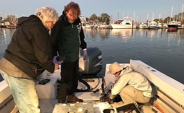 Ellen Thomas, Harold T. Stearns, a grad student, and recently retired earth and environmental professor and former scientist on the long island sound partnership committee Joop Varekamp collect water samples at a site. 