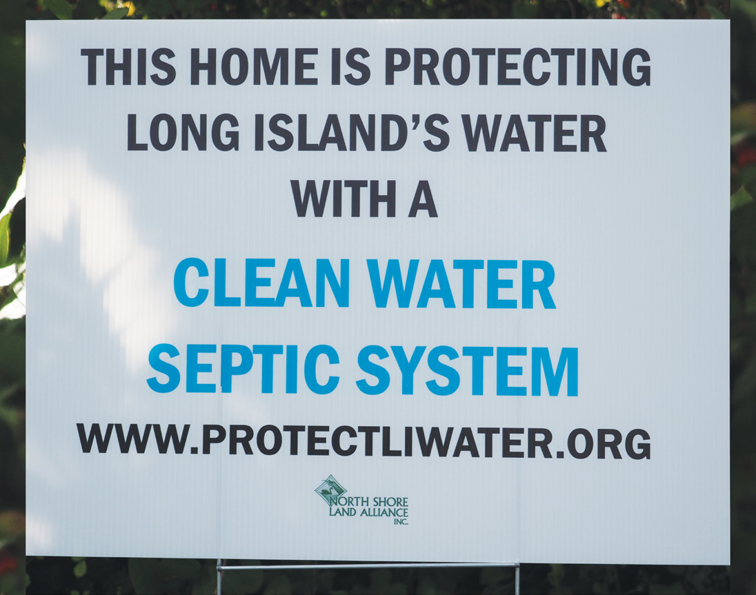 A lawn sign promotes the new enhanced septic systems.