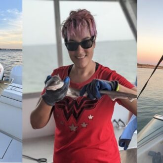 Two women hold fish and a man on a boat