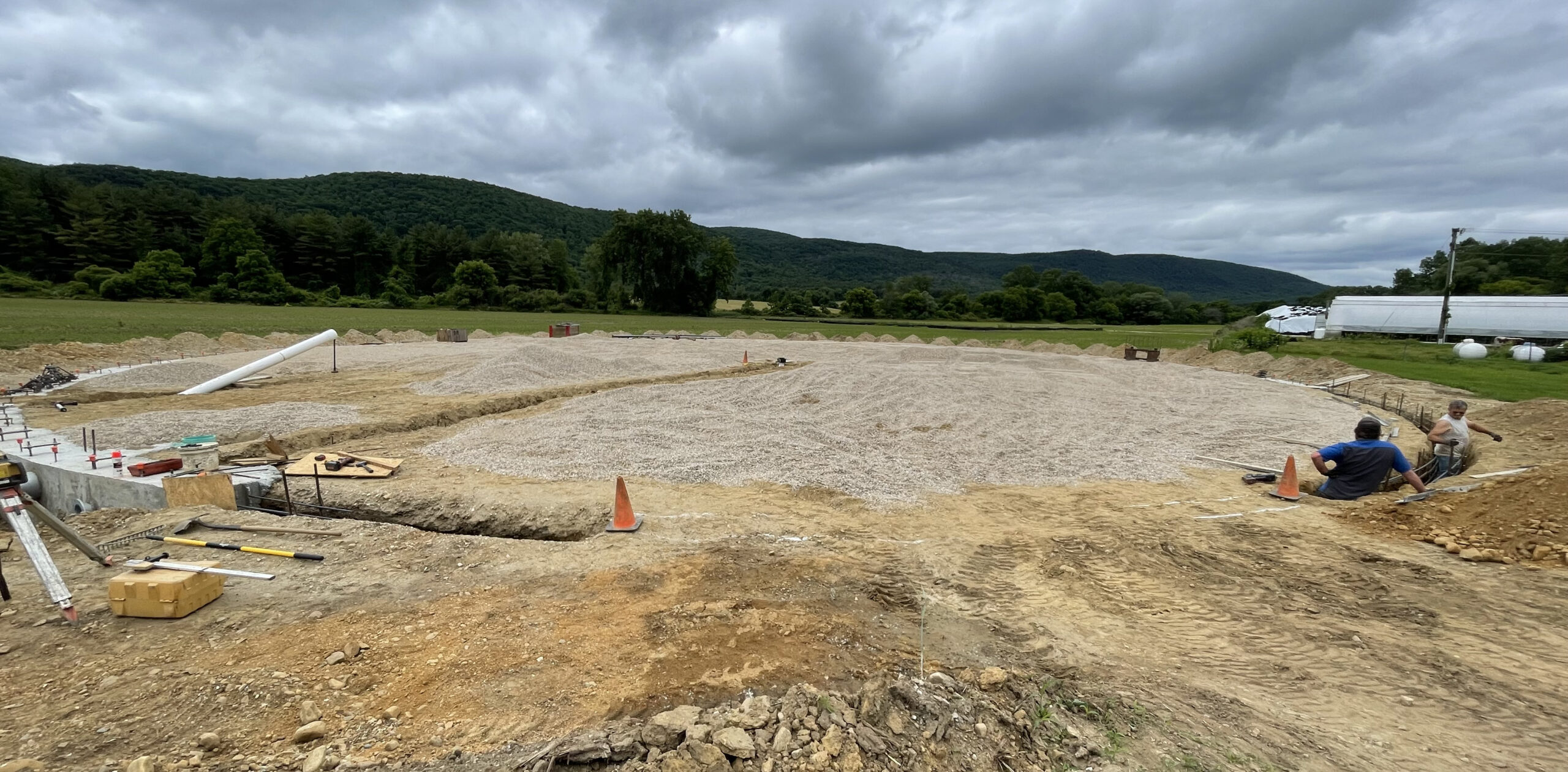 A large construction area showing dirt and gravel laid in a large circle.