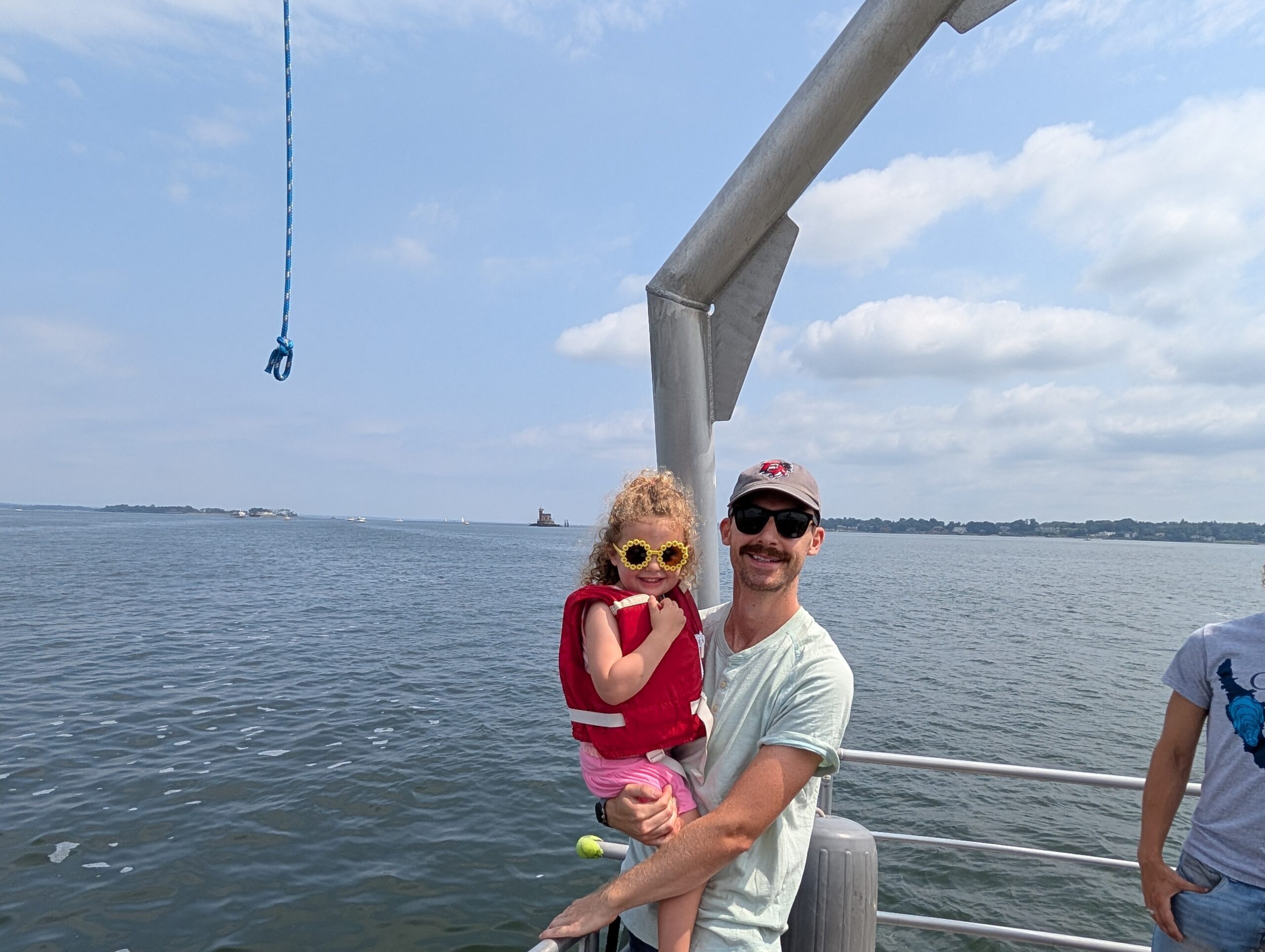 A father and his daughter pose while enjoying the boat ride during the Long Island Partnership’s 40th anniversary celebration in the Bronx on August 16, 2025. Credit: [Robert Burg/NEIWPCC]